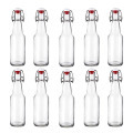 Wholesale Clear Round Glass Beer Bottles Beverage bottles with swing top